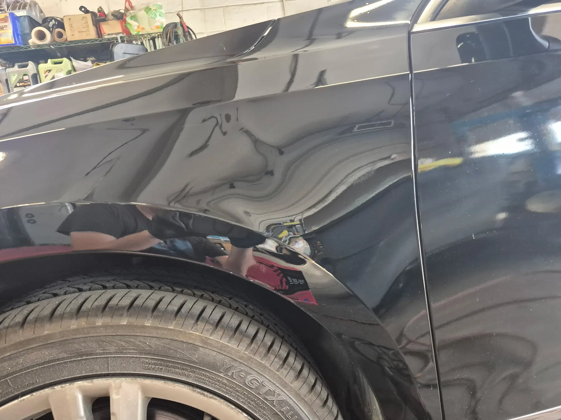 Glossy black side panel after polishing